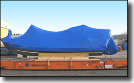 shrink wrap boat and blocking, securing on top of a flat-rack for shipping